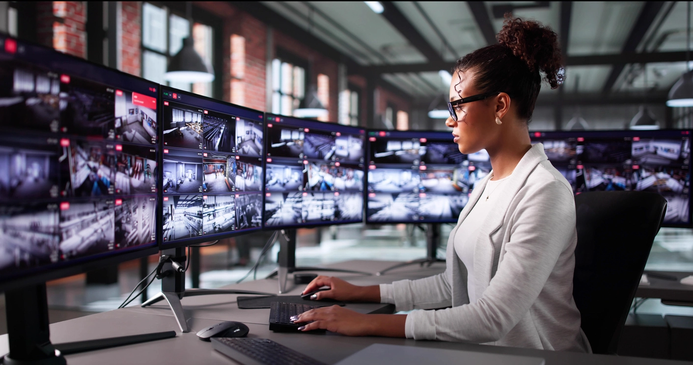 security monitoring display showing dispatch center surveillance camera feeds