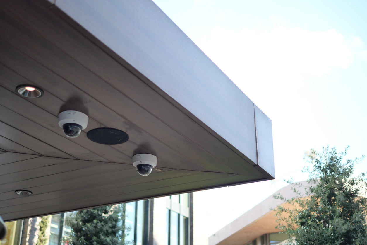 security camera monitoring controlled access door inside police department