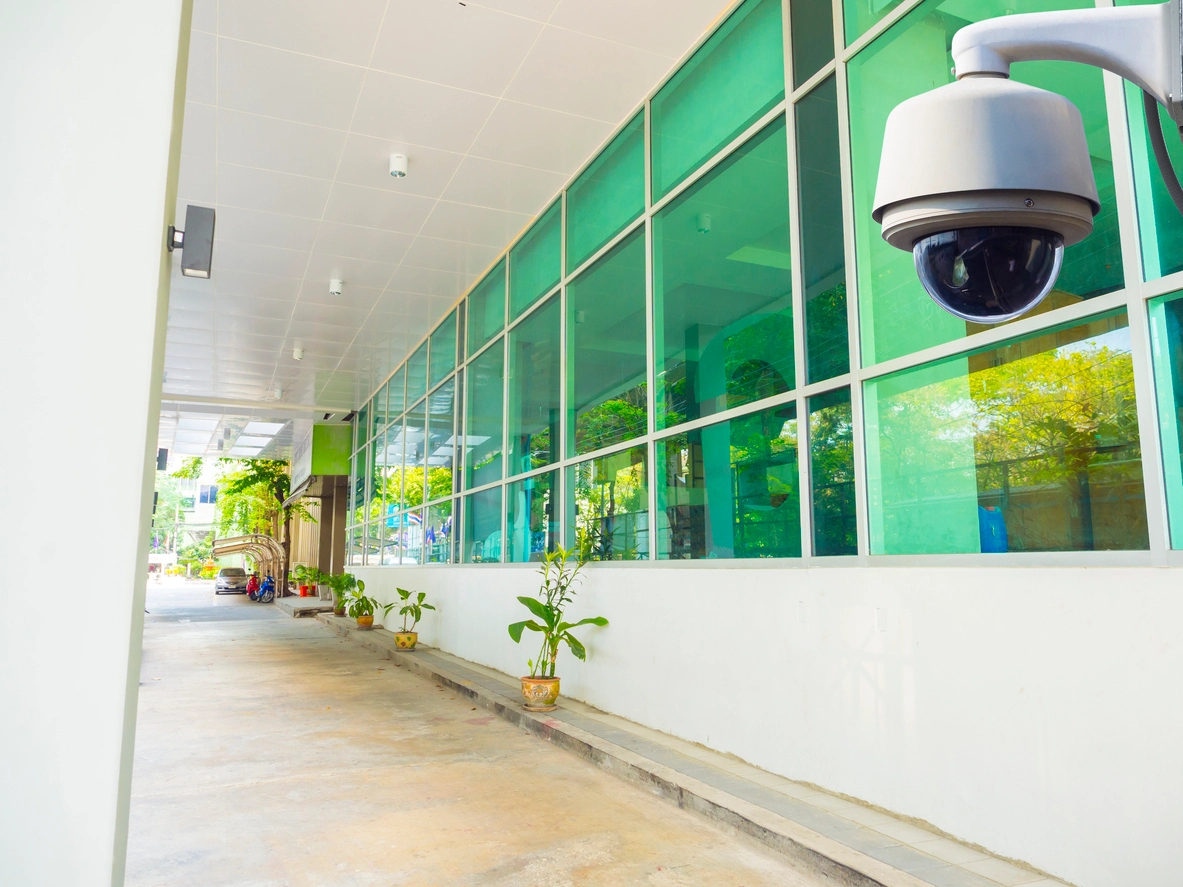 security camera monitoring school hallway near main entrance