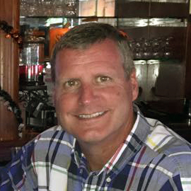 A headshot of John Beagle