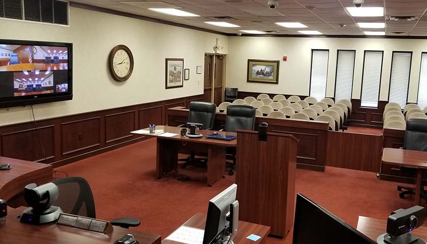 An empty courtroom with Lifesize video equipment set up